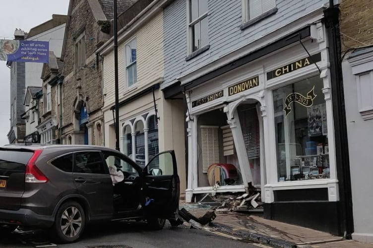 The vehicle and the shop front on Sunday October 26 after the collision - Hazel Donovan