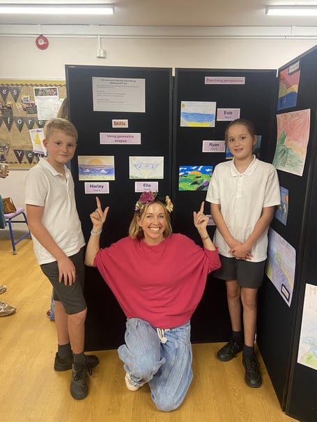Artist Becky Bettesworth with two pupils