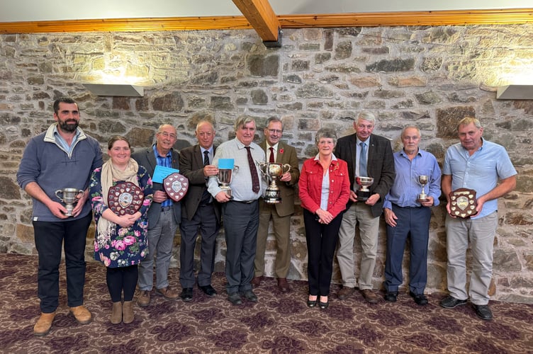 Devon County Ploughing Association 2025 winners and the association officers with, centre, Devon Champion Peter Stone, fifth left. AQ 7143