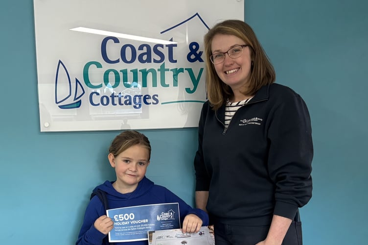 Matilda with Coast & Country Cottages PR executive Vicky Rogers, collecting her prize