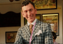 One of two men missing from a festive Budleigh Salterton swim has been named.