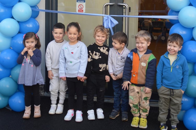 Boringdon preschool pupils cut ribbon at Bright Beginnings open event.