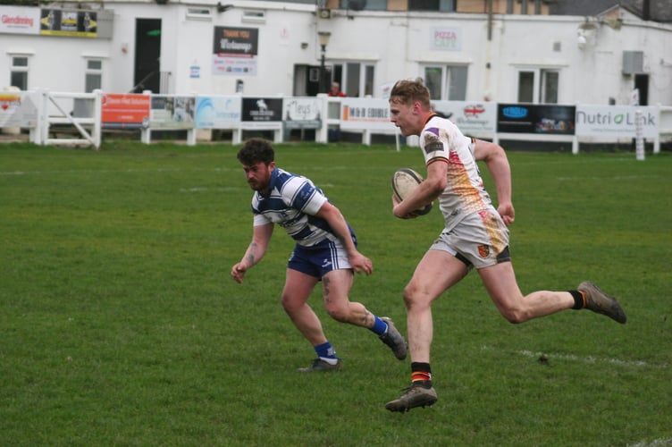 Callum Westaway on his way to scoring Newton's second try