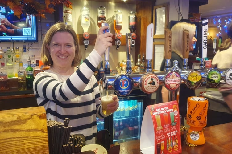Rebecca pulls a pint