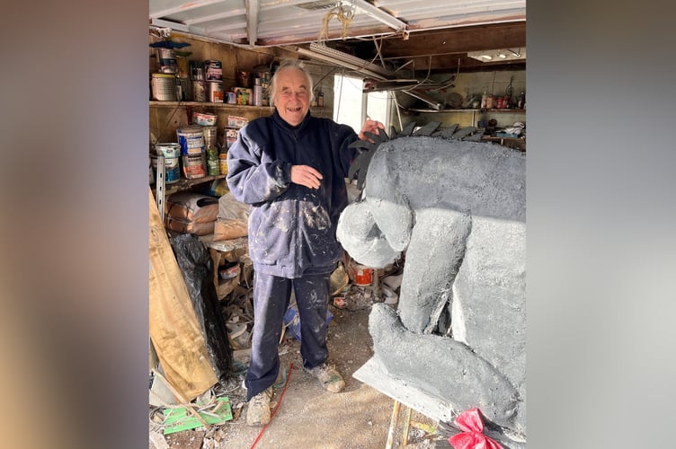 Malcolm Curley with Eeyore sculpture.