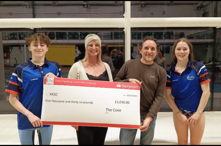 Club captains Lucas Quiggin and Hana Wood accept The Cove’s donation