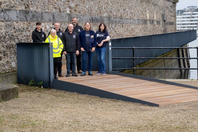Part of South West Coastal path reopens in Plymouth. Mia Harnett, Skeldons, South West Coast Path Association group photo.