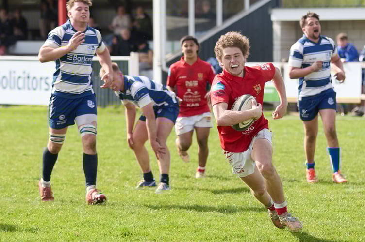 Kingsbridge's defenders give up the chase as Barnstaple Athletic winger Haydn Gosling scorches through for his third try