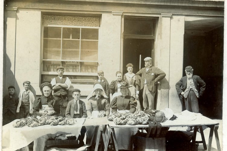 Group selling crabs outside the White Hart, Fore Street, Kingsbridge