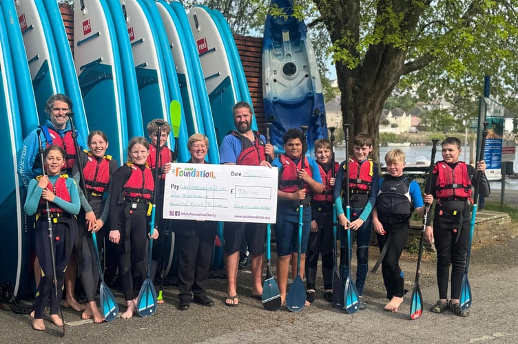 Waterborn Hub CIC receive a cheque from the Asda Foundation for the 'Blue Horizons SUP Club' project.