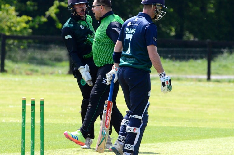 Celebration time for Ivybridge skipper Adam Huxtable, who has just dismissed Bridestowe & Belstone opposite number Tallan Burns for a second-ball duck