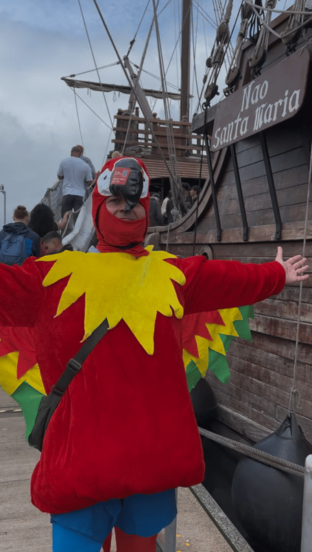 David Middleton dressed as a Giant Red Parrot