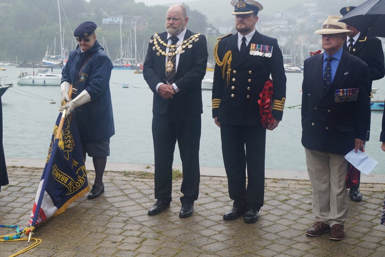 A moment of reflection as the standard is lowered at the poignant service held at the D-Day memorial on South Embankment.