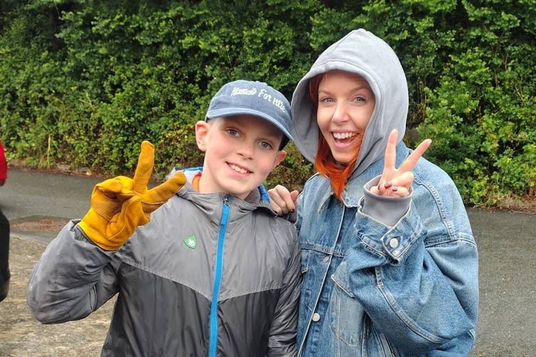 Stacey Dooley with Whitleigh Community Primary School pupil Joshua Birch during the Masefield Gardens litter pick. Joshua was the YMCA Youth Environmentalist Of The Year 2025. Image courtesy: Sheila Birch