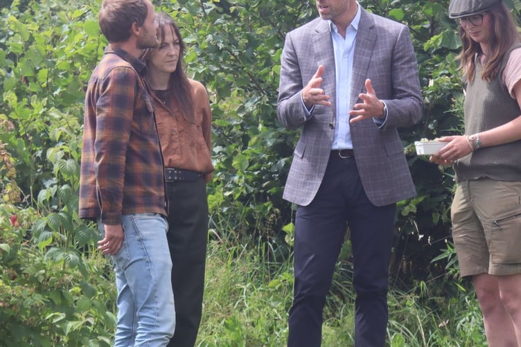 HRH discussing farming
