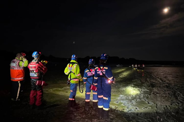Three stranded in the mud rescued
