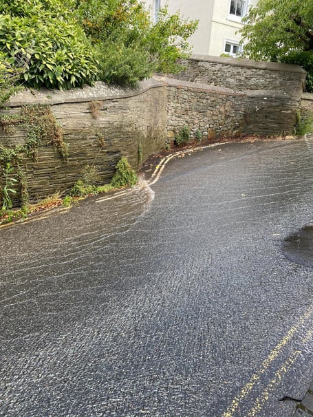 A torrent of water currently running down Belle Hill