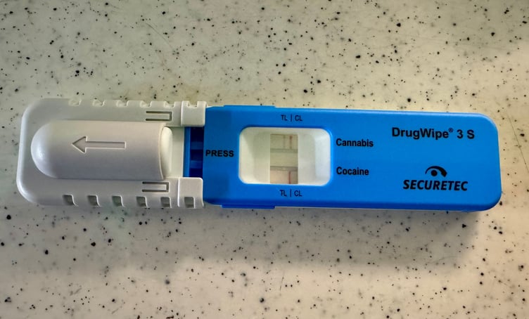Drug test device