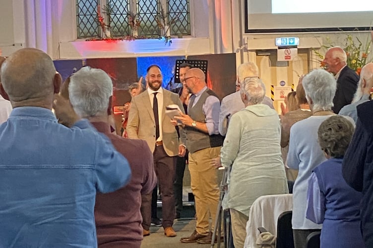 A church congregation celebrating the Ordination of their new Pastor Jonny Richmon